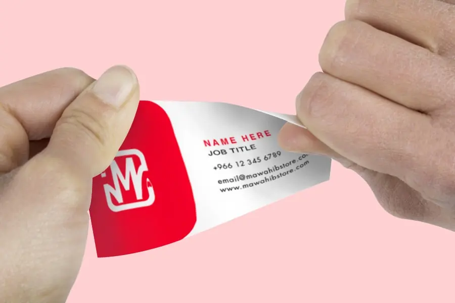Flexible synthetic business card being bent